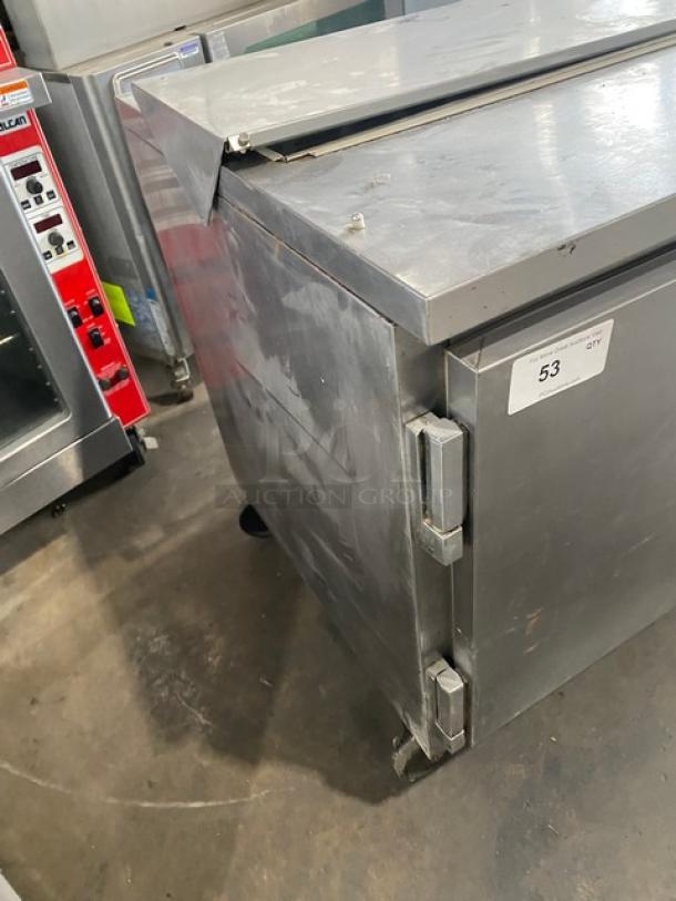 Beverage-Air SP60-16 stainless steel 2-door refrigerated prep table on casters, model tag visible, commercial use.