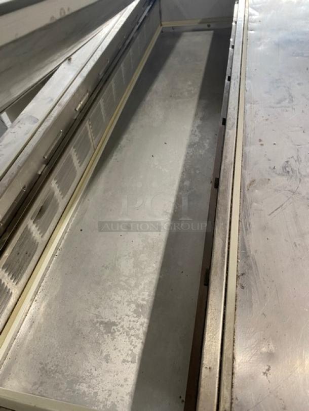 Beverage-Air SP60-16 stainless steel refrigerated prep table, 2 doors, worn condition, on casters, 115V, 1 phase.