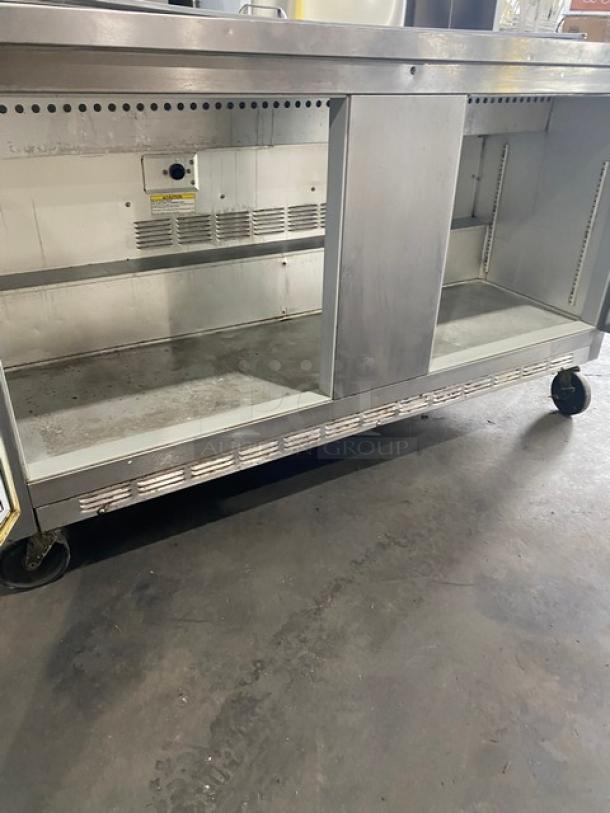 Beverage-Air SP60-16 stainless steel 2-door refrigerated prep table, 115V, on casters, used condition, spacious interior.