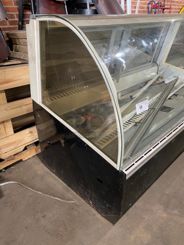 Federal Industries SN6CD2 refrigerated display case with curved glass, rear double sliding doors, 120V, used condition.
