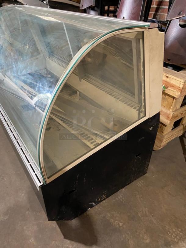 Federal Industries curved glass deli display case, model SN6CD2, with rear sliding doors, 120V, 1 phase, good condition.