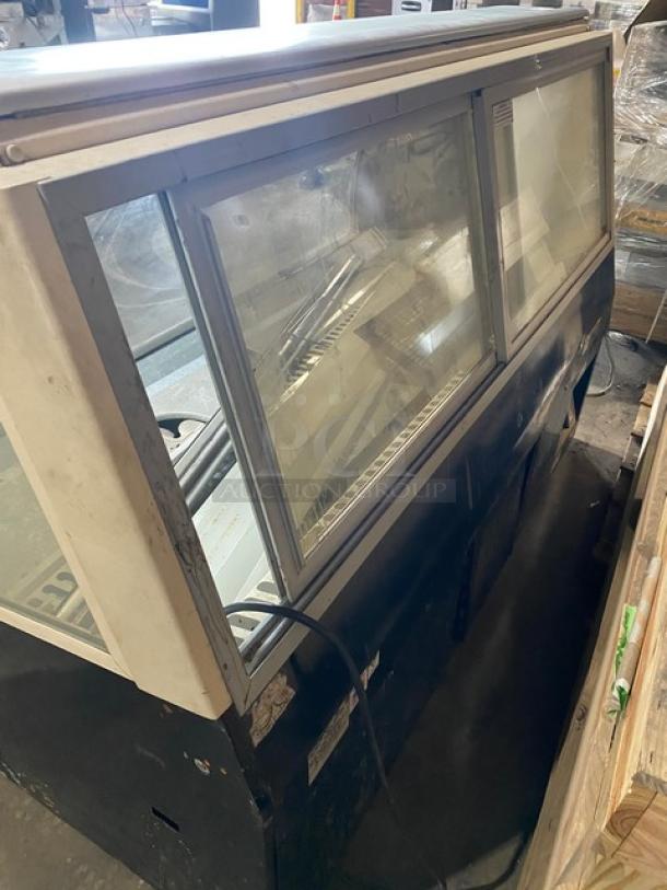 Federal Industries SN6CD2 curved glass refrigerated meat deli display case, rear sliding glass doors, 120V, used condition.