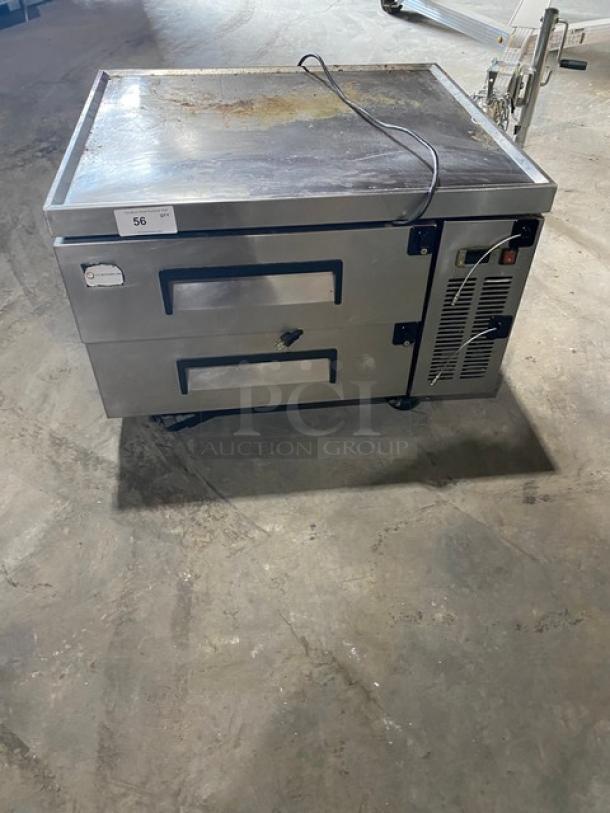 Commercial stainless steel 2-drawer refrigerated chef base, Model CB36, 115V, on casters, visible wear on top surface.