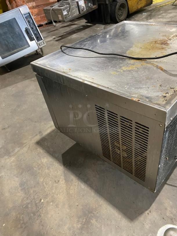 Commercial stainless steel 2-drawer refrigerated chef base, model CB36, 115V, on casters, visible wear and surface marks.
