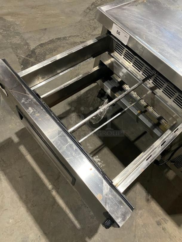 Commercial Stainless Steel 2 Drawer Refrigerated Chef Base, Model CB36, on casters, shown with one drawer open.
