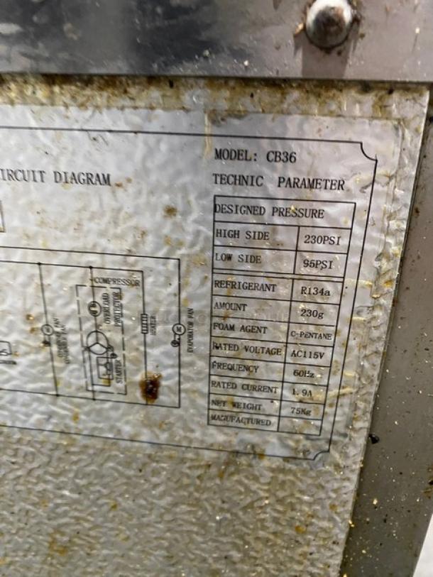 Commercial Stainless Steel 2 Drawer Refrigerated Chef Base, Model CB36, 115V, on casters. Shown: technical parameters tag.