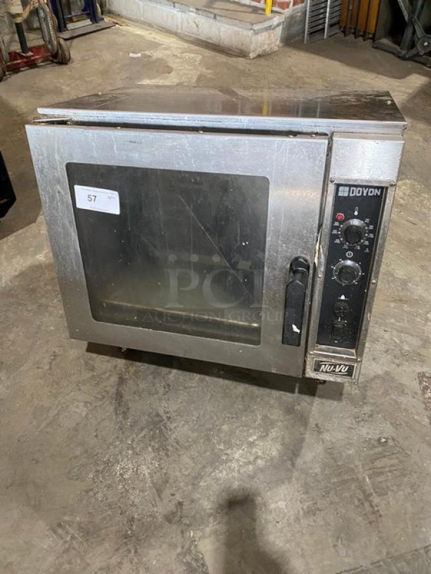 Nu-Vu Doyon Series NCO5 stainless steel convection oven, 208V 1 Phase, thermostatic control, on legs, fair condition.