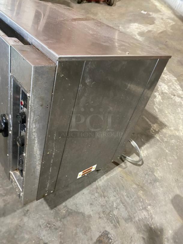 Nu-Vu NCO5 stainless steel countertop convection oven, electric, thermostatic control, 208V, single phase, on legs.