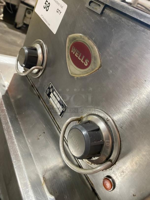 Wells Model H70 stainless steel 2-burner electric hotplate. Features individual controls, serial number H7700717A0001, 208-240V.