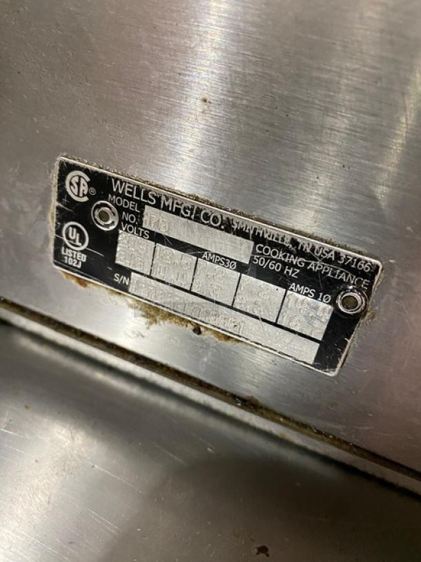 Wells H70 stainless steel electric 2-burner hotplate, UL listed, 208-240V, model and serial number label visible.