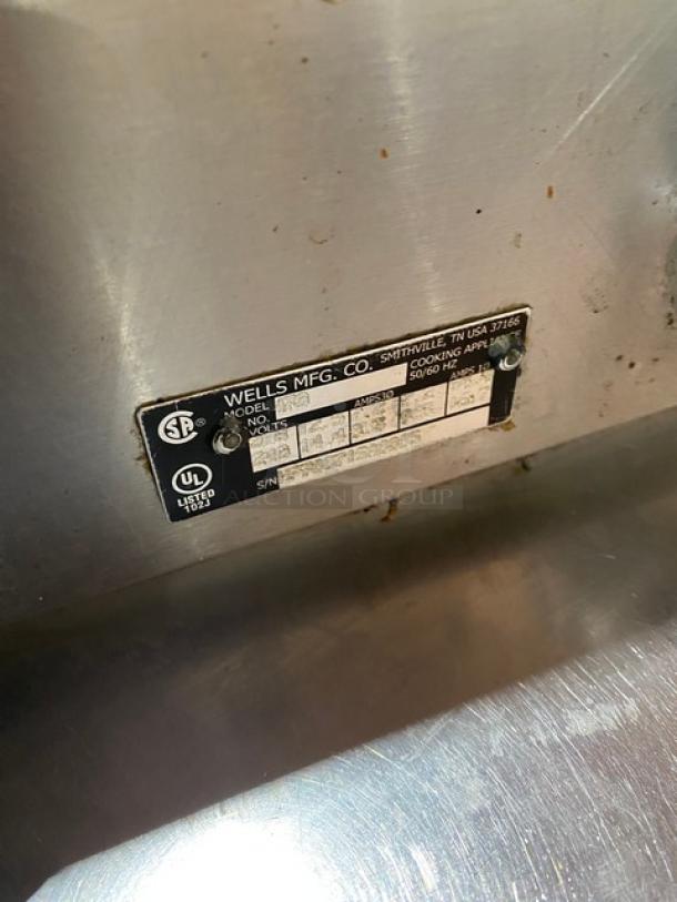 Wells Model H70 stainless steel 2-burner hotplate, electric powered. Features individual controls. Serial No: H7700717A0006.