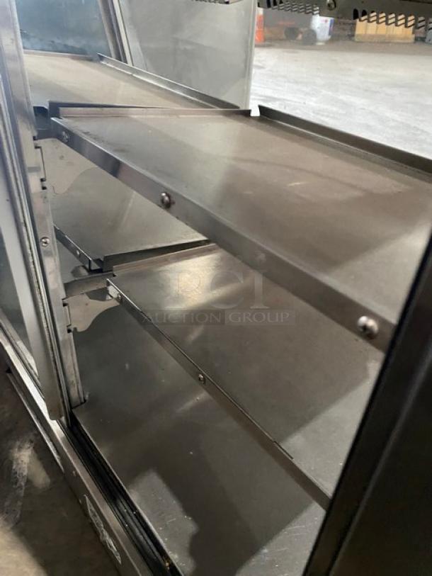 Vendo stainless steel electric hot food merchandiser display case with rear double glass sliding doors, 115V, multi-level shelves.
