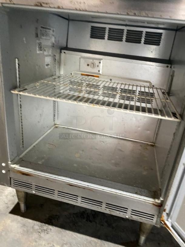 Beverage-Air WTF27A worktop freezer, stainless steel, single door, with poly coated wire rack, shows signs of use, on legs.