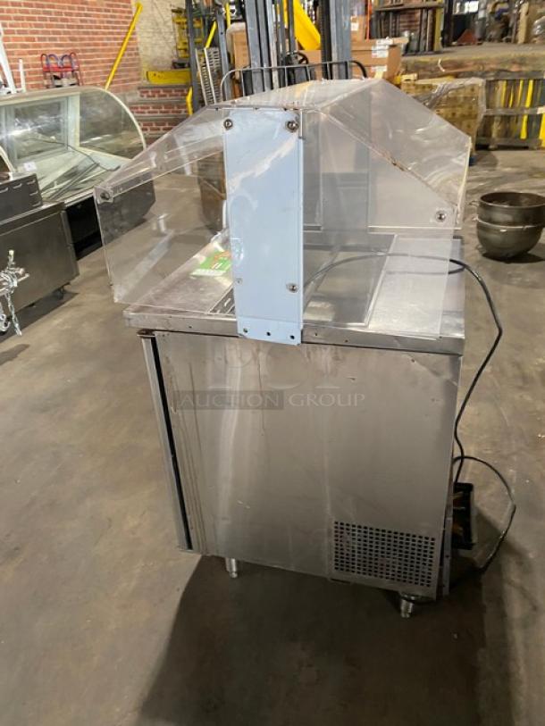 Turbo Air M3 Series refrigerated prep table with sneeze guard, Model MST-28-711S, on legs, stainless steel, poly-coated wire rack.
