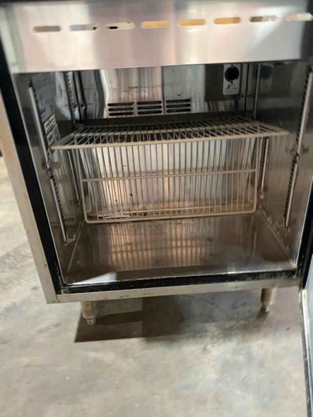 Turbo Air MST-28-711S refrigerated prep table with sneeze guard, poly-coated wire rack, stainless steel, 115V, on legs.