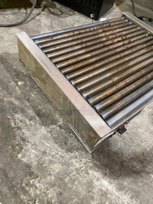 Nemco stainless steel electric countertop hot dog roller grill, used condition, visible wear. Ideal for commercial use.