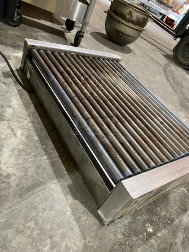 Nemco commercial stainless steel electric countertop hot dog roller grill, shows signs of use, ideal for concession stands.