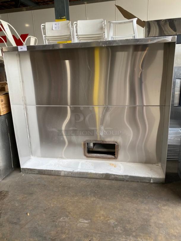 Commercial stainless steel kitchen exhaust hood, large, vent opening, shiny finish, good condition, ideal for restaurants.