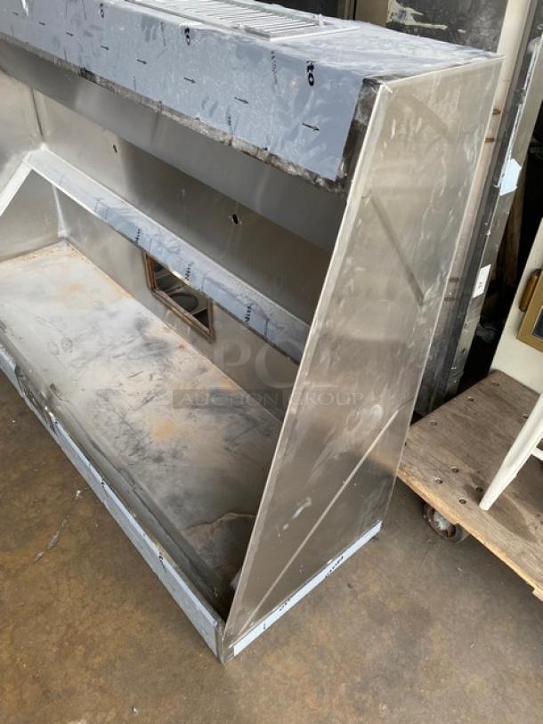 Pro Kitchen Supply stainless steel kitchen exhaust hood, model UHGV. Features durable construction. Some surface wear visible.