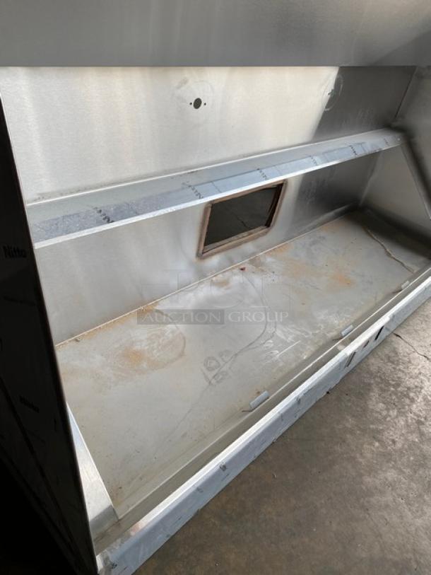 Pro Kitchen Supply stainless steel kitchen exhaust hood, Model UHGV. Features industrial design, visible use marks.