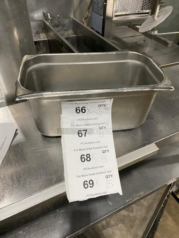 Commercial stainless steel steamtable pan, rectangular, durable, with visible auction labels showing lot numbers and bid quantities.