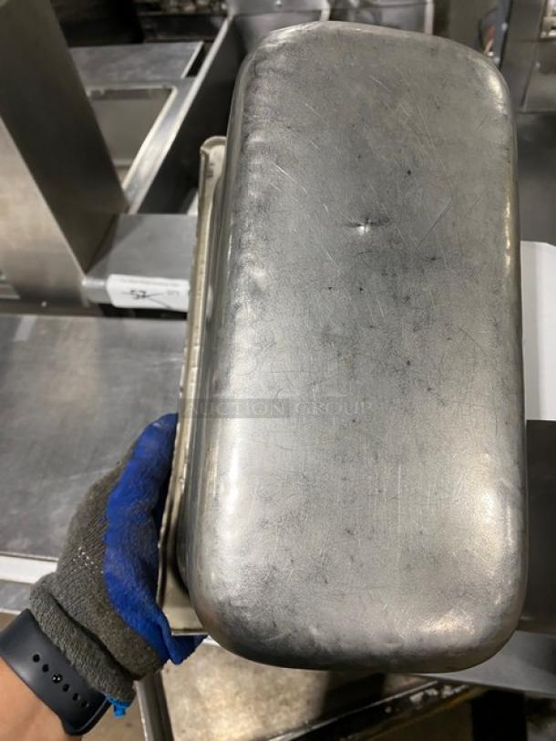 Commercial stainless steel steamtable pan, rectangular, well-used condition, visible scratches, ideal for hotel use.