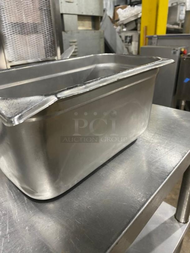 Stainless steel hotel/steamtable pan in good condition, rectangular with smooth edges, ideal for commercial kitchens.