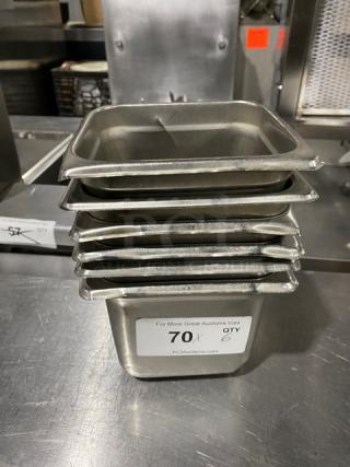 Stainless steel steamtable pans stack, commercial use, label reads "70X QTY 6," ideal for hotel or catering settings.