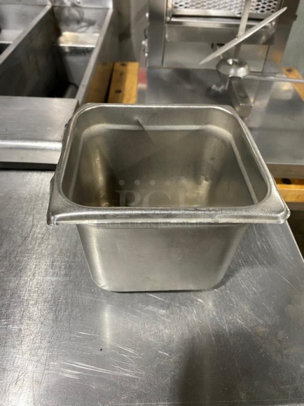 Commercial stainless steel steamtable pan, square shape, used condition, visible scuff marks, suitable for hotel use.
