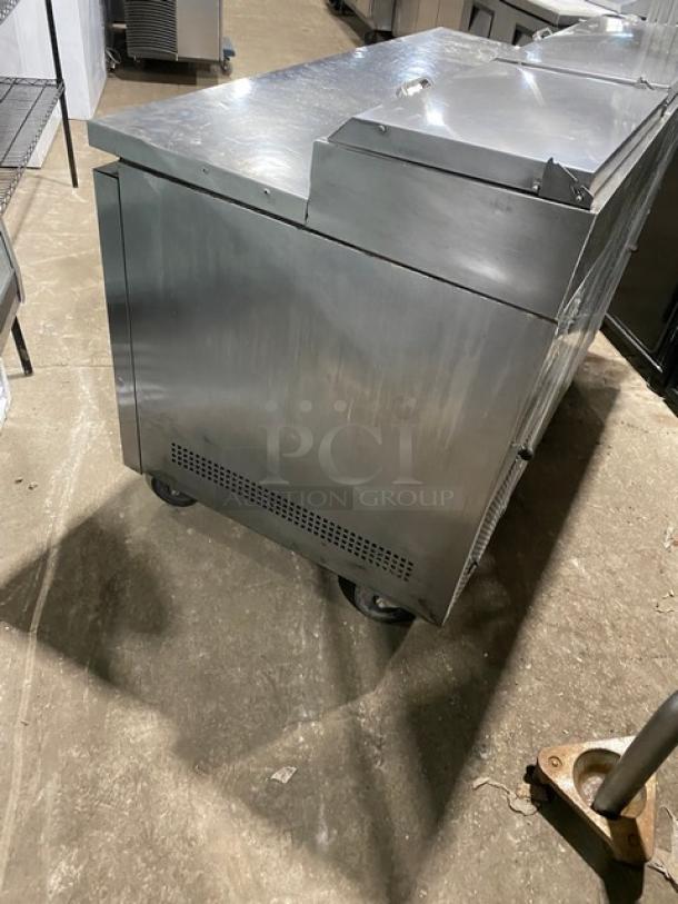 True TPP60 stainless steel refrigerated pizza prep table, two doors, poly-coated rack, on casters, 115V, commercial use.