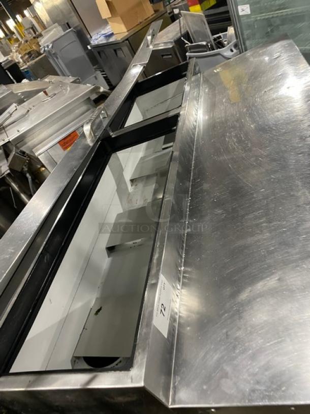 True Commercial Stainless Steel 2 Door Refrigerated Pizza Prep Table, Model TPP-60, with poly-coated wired rack, on casters.