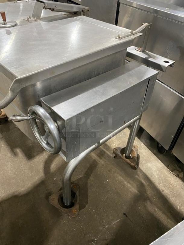 Groen stainless steel natural gas tilt skillet, model HFP2E4, on legs. Features crank handle, sturdy build, minor wear.
