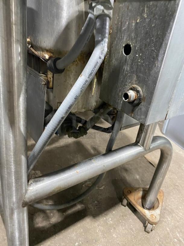 Groen HFP2E4 stainless steel tilt skillet, natural gas, visible wiring, mounted on legs, model SN: 24542HCF.