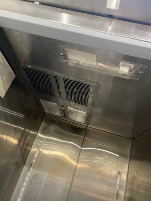 Norlake commercial stainless steel single door freezer, model NF241SSS0 on casters, with poly-coated wire rack, 115V, good condition.