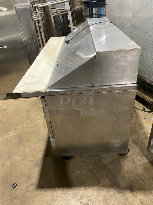 Beverage-Air SP72-30M refrigerated prep table, stainless steel, 3-door, bain marie style, with cutting board, on casters.