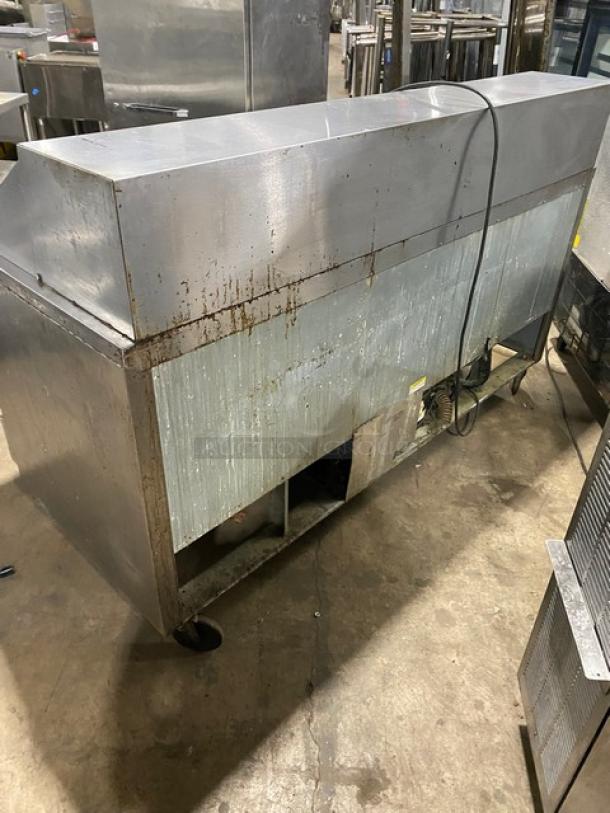Beverage-Air 3-Door Refrigerated Bain Marie Prep Table, Model SP72-30M, stainless steel, on casters, with cutting board. Signs of wear.