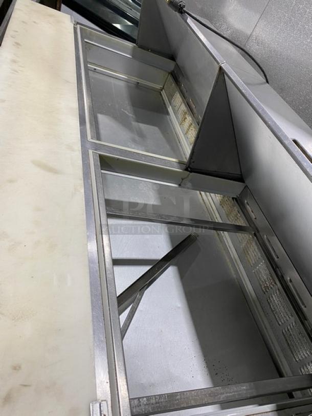 Beverage-Air 3-door stainless steel refrigerated prep table, model SP7230M, with cutting board and poly-coated rack.