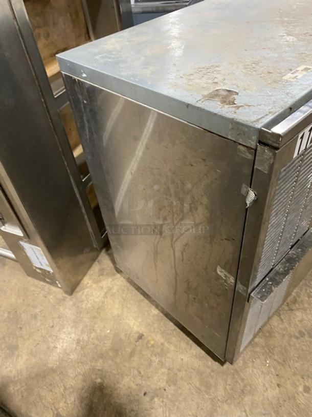 Perlick stainless steel 4-door refrigerated back bar cabinet with poly-coated wire rack, SN: 518921. Visible wear on surface.