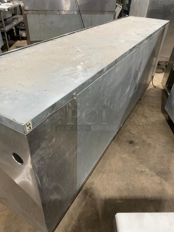 Perlick stainless steel 4-door refrigerated back bar cabinet with poly coated rack, SN: 518921, in used condition.