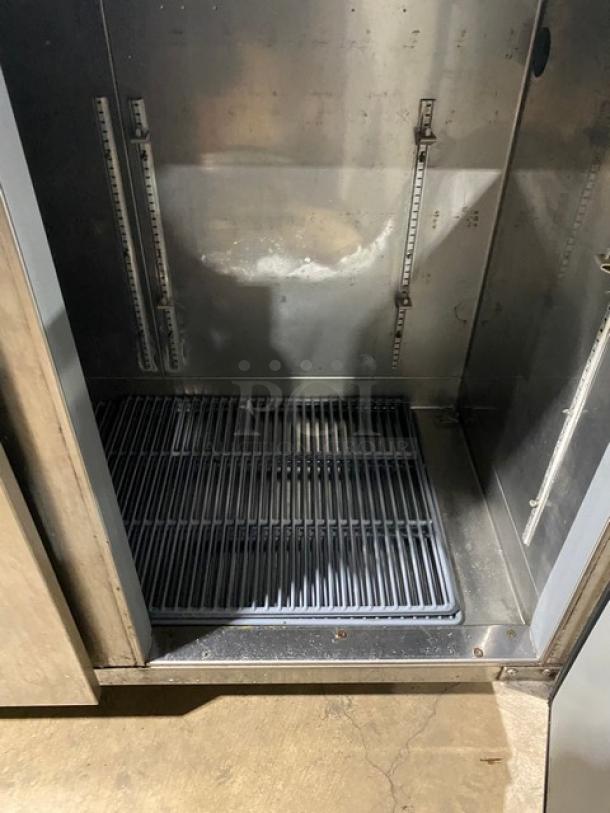 Perlick commercial stainless steel 4-door refrigerated back bar cabinet, featuring a poly-coated wired rack. SN: 518921.