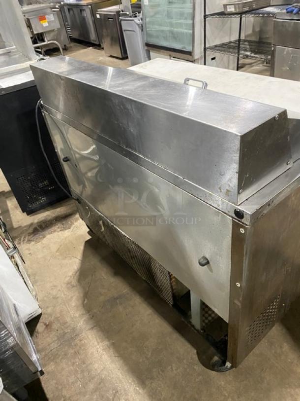 True TSSU-48-12 commercial refrigerated prep table, stainless steel, 2-door, cutting board, poly rack, on casters, 115V.
