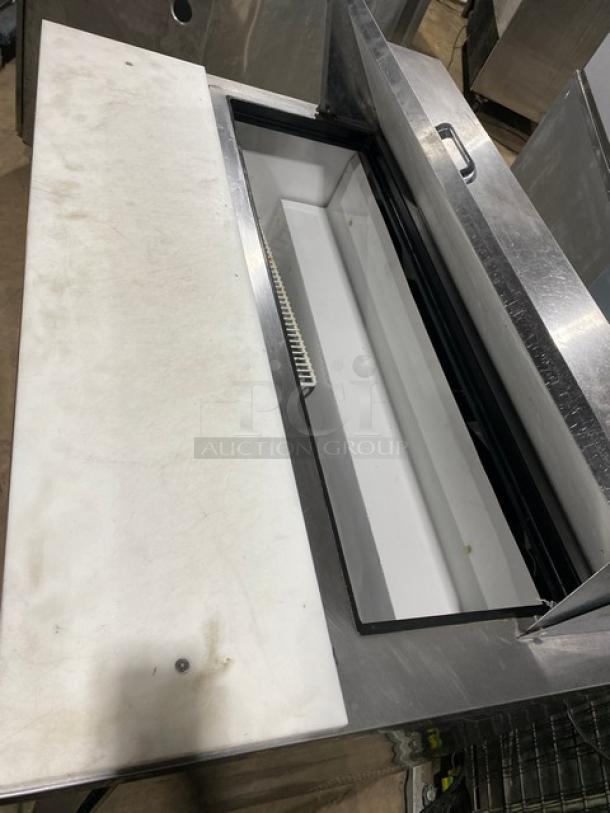 True TSSU-48-12 refrigerated prep table with cutting board and poly-coated rack. Stainless steel, on casters, 115V, 1 Phase.