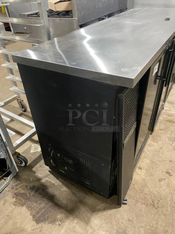 True commercial back bar cabinet with stainless steel worktop, black triple glass swing doors, and wired rack, Model TBB-24-72G.