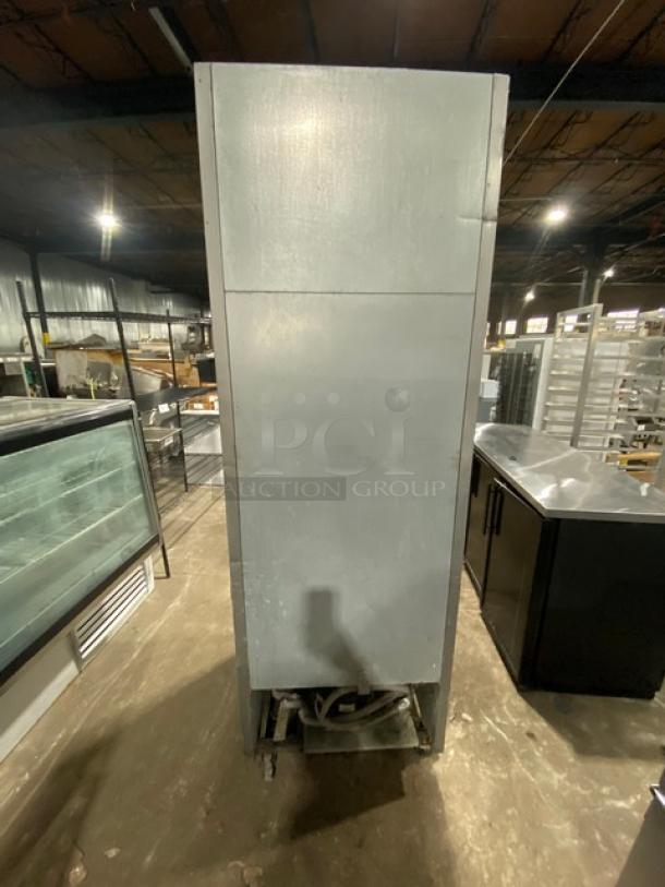 Beverage-Air KR24-1AS commercial refrigerator, stainless steel, single door, on casters, with poly coated wire rack.