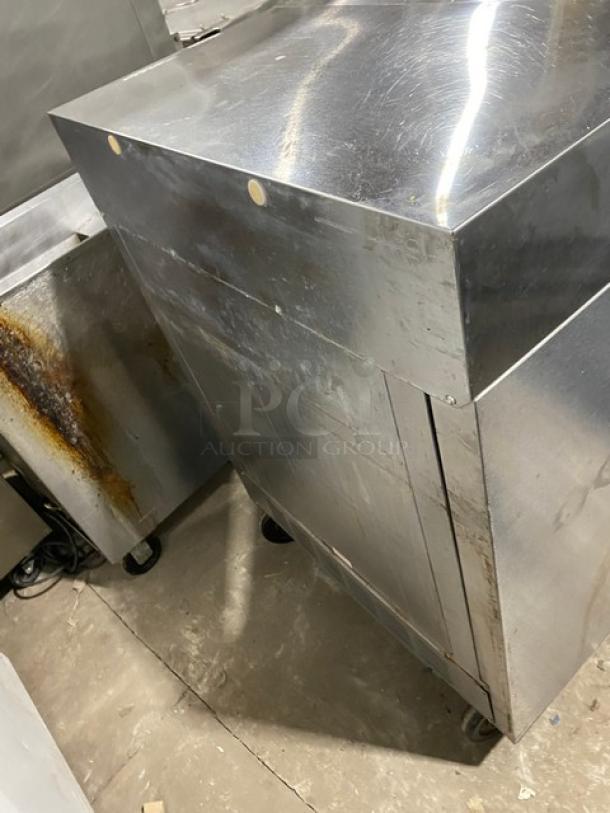 Beverage-Air SMF34 stainless steel milk cooler on casters, showing wear. Model and serial numbers visible. 115V, 1 phase.