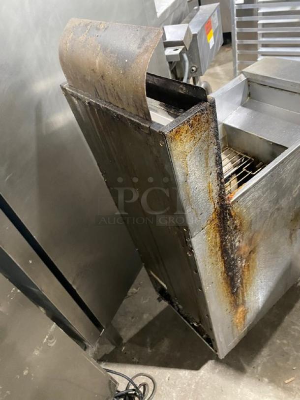 Frymaster GF40SC commercial stainless steel deep fat fryer with back splash, basket hanger, and casters. Natural gas. Visible wear.