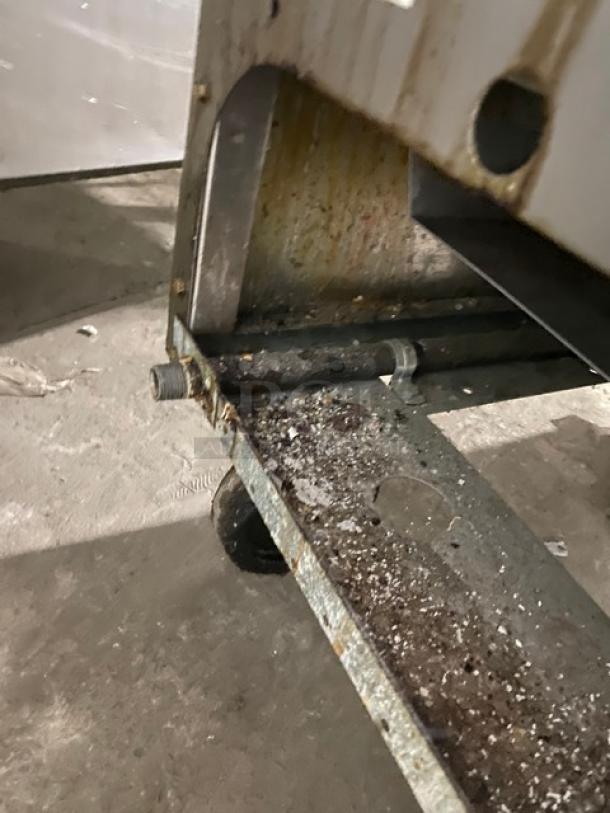 Frymaster GF40SC stainless steel deep fryer, natural gas, with back splash, basket hanger, on casters, serial: 1806F00008. Condition shows signs of wear.
