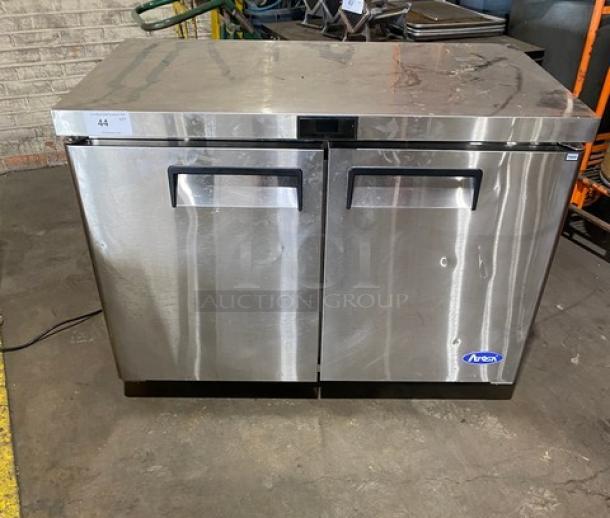 Atosa 2024 commercial stainless steel 2-door undercounter worktop freezer, Model MGF8406GR, with poly coated wire rack, on casters.