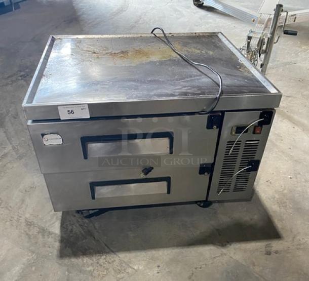 Commercial stainless steel 2-drawer refrigerated chef base, model CB36, 115V, on casters, with visible wear and power cord.