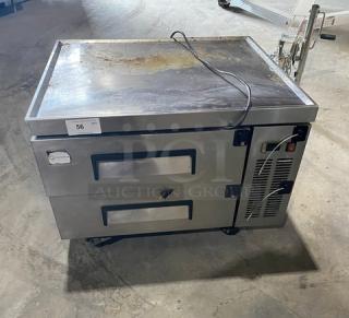 Commercial stainless steel 2-drawer refrigerated chef base, model CB36, 115V, on casters, with visible wear and power cord.